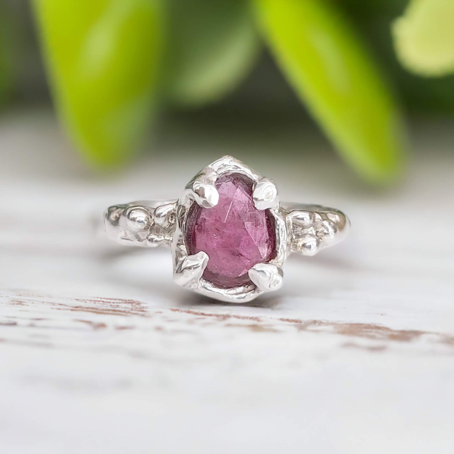 Pink Sapphire engagement ring in textured sterling silver setting, showcasing a unique nature-inspired design.