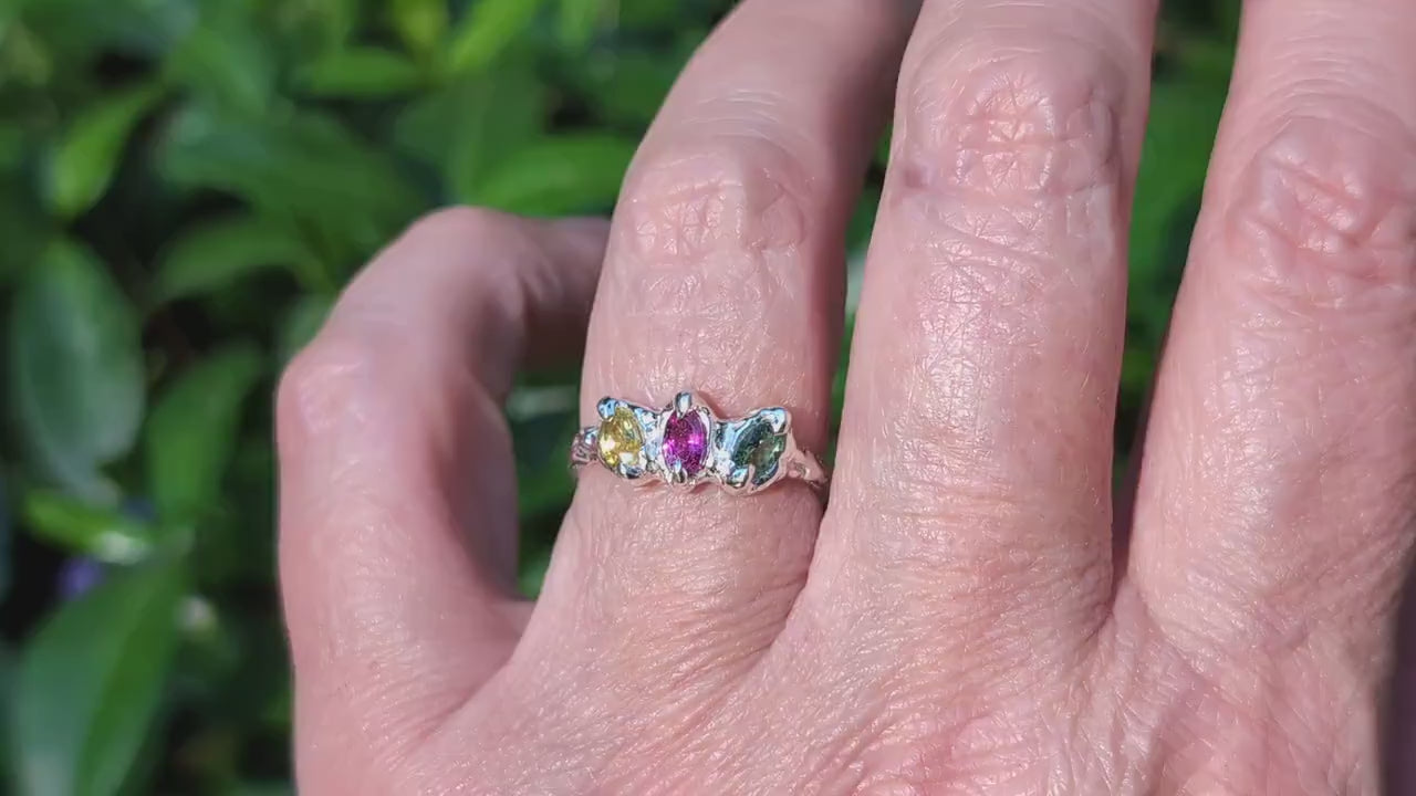 Natural multi Tourmaline Silver ring displayed on a hand, featuring three colorful gemstones in Sterling Silver.