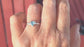 Solid Silver Aquamarine ring with trilliant shape gemstone, showcasing unique handcrafted design and organic textured band.