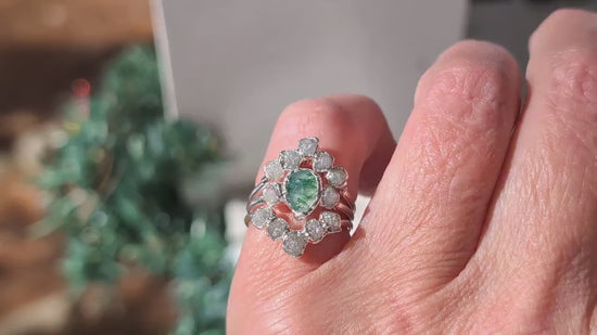 Moss Agate and raw diamond bridal ring set showcased on hand, featuring intricate silver detailing.