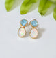 Dainty raw aquamarine and opal stud earrings with gold settings, perfect for bridal or everyday wear.