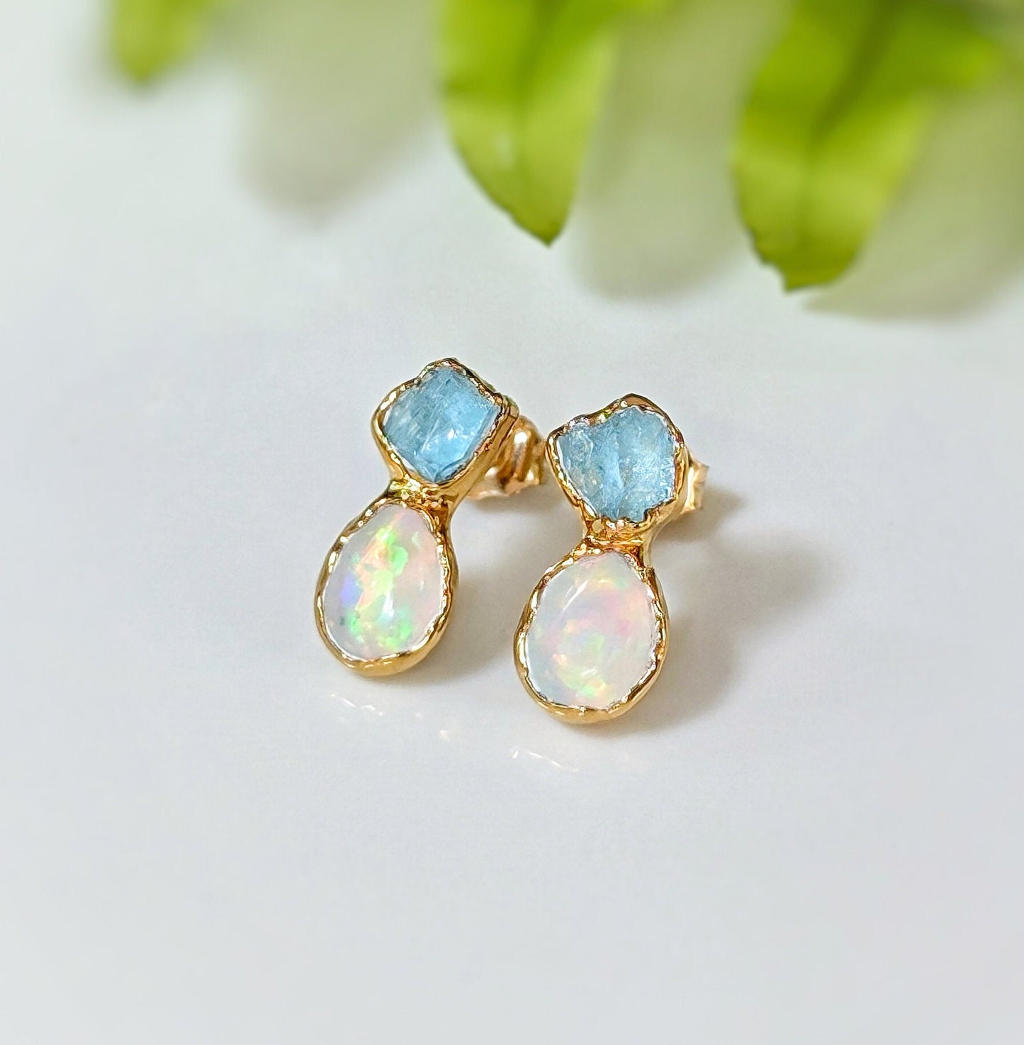 Dainty raw Aquamarine and Opal stud earrings with gold setting, perfect for bridal or everyday wear.