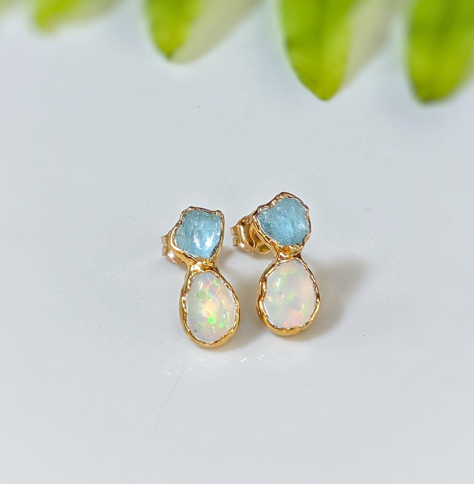 Dainty raw Aquamarine and Opal stud earrings in gold, ideal for special occasions or everyday elegance.