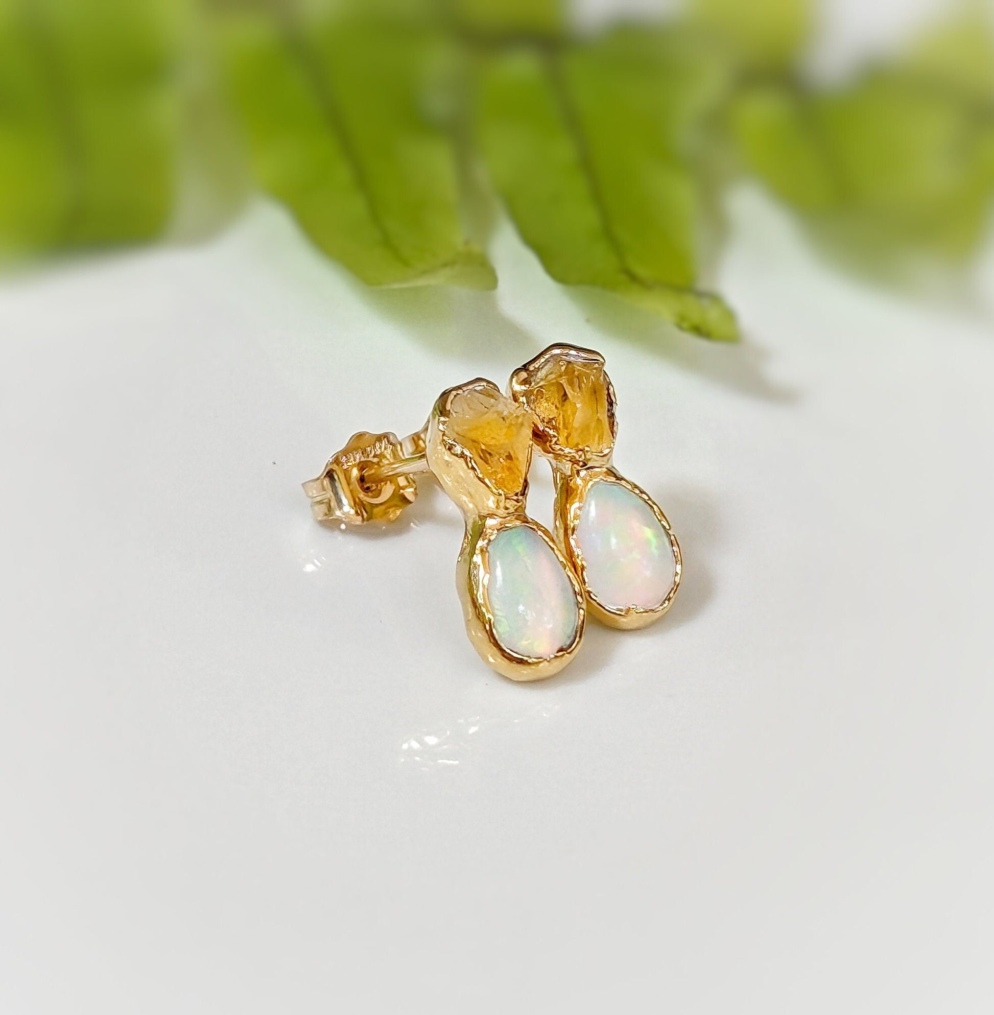 Dainty raw Citrine and Opal stud earrings with gold accents on a soft background, perfect for bridal wear or unique gifts.