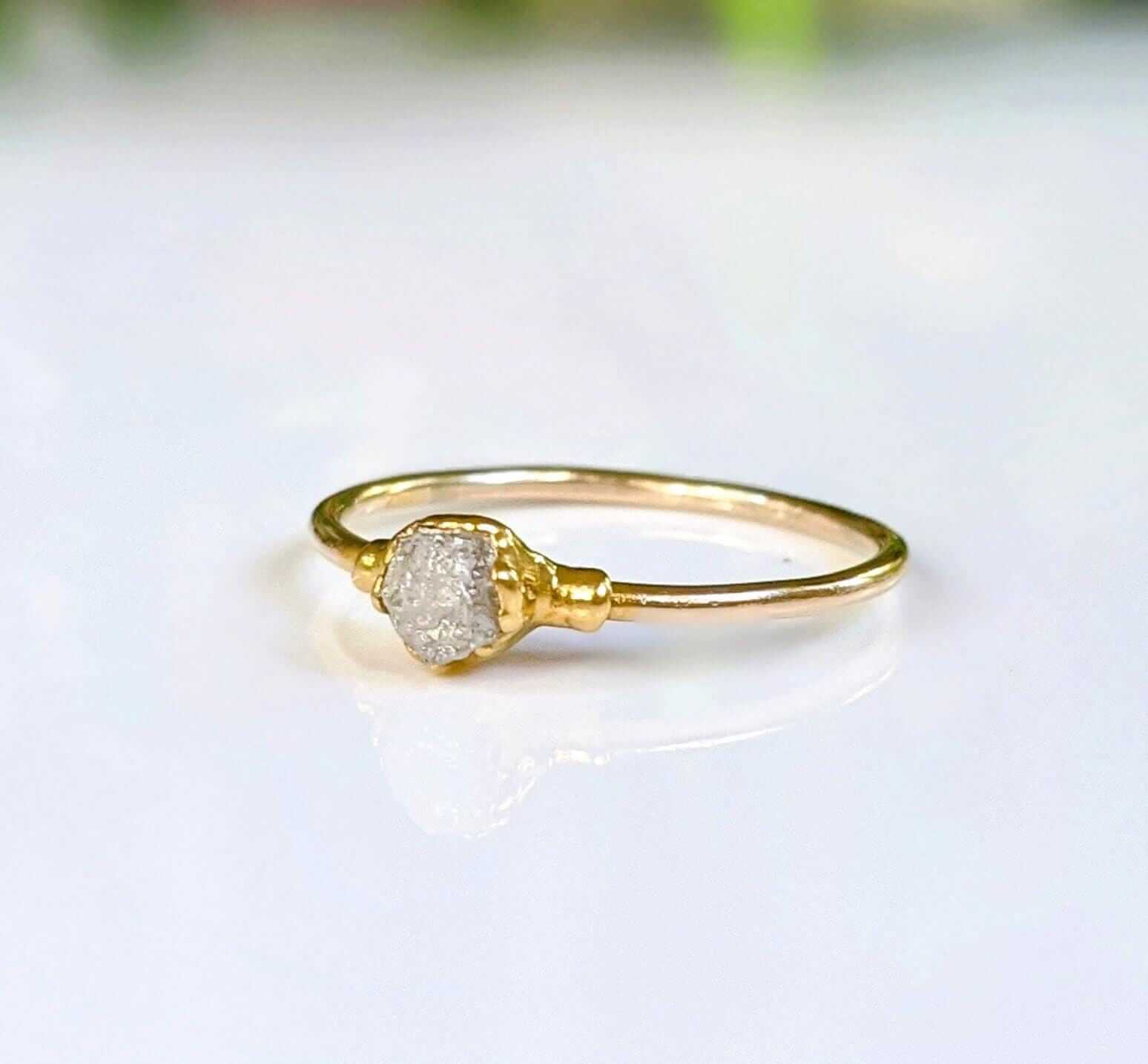Rustic raw diamond engagement ring in solid 14k gold, featuring a unique crystal design for a romantic touch.