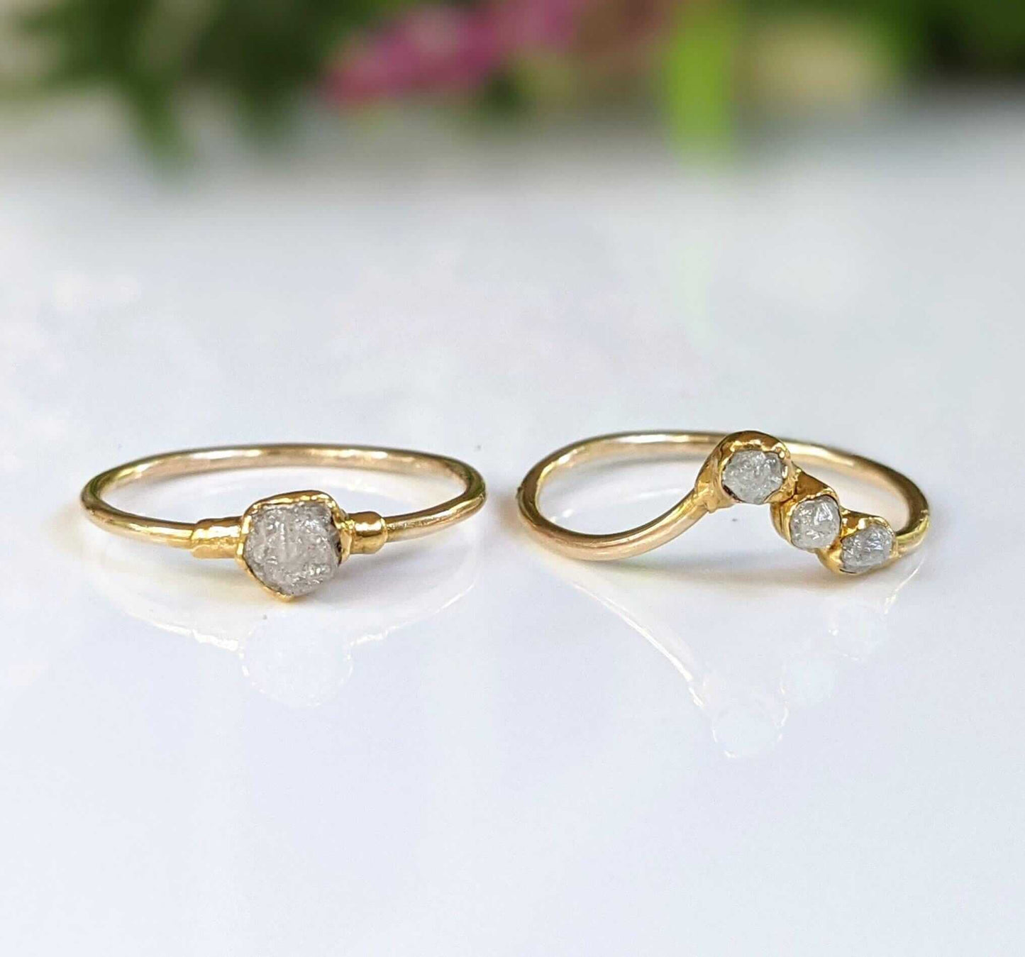 Raw diamond engagement rings in solid 14k gold, showcasing rustic elegance and unique crystal designs.