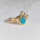 Raw Peruvian Opal engagement ring set with diamond accents in yellow gold, showcasing unique aqua-blue hues.