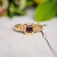 Square red garnet engagement ring in solid 14k gold with an organic textured band.