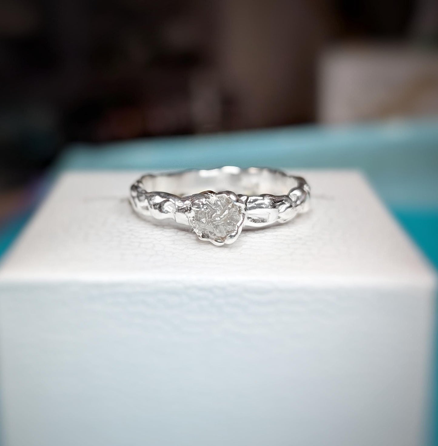 Rough diamond engagement ring in recycled Sterling Silver with Molten texture and unique design.