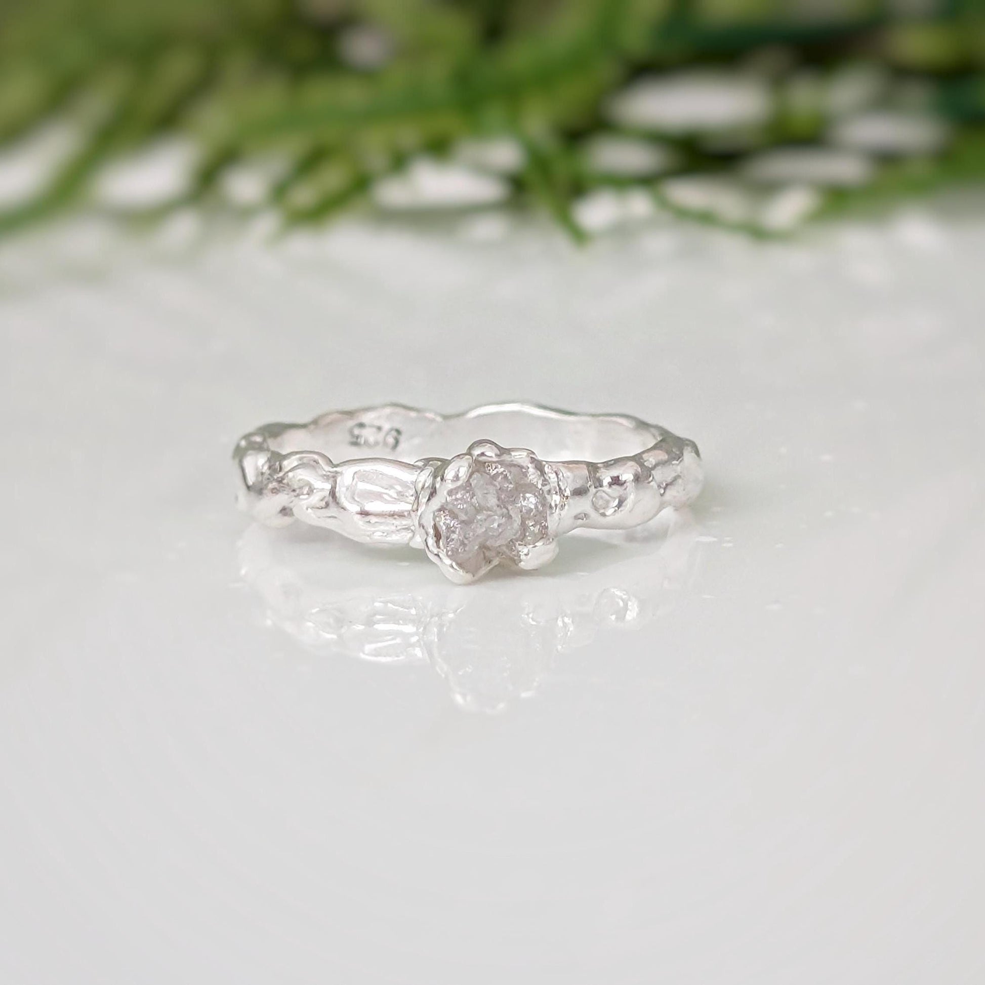 Rustic raw diamond engagement ring in recycled Sterling Silver, featuring unique molten texture and organic elegance.
