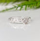 Rustic raw diamond engagement ring set in recycled sterling silver, featuring an organic, molten texture.