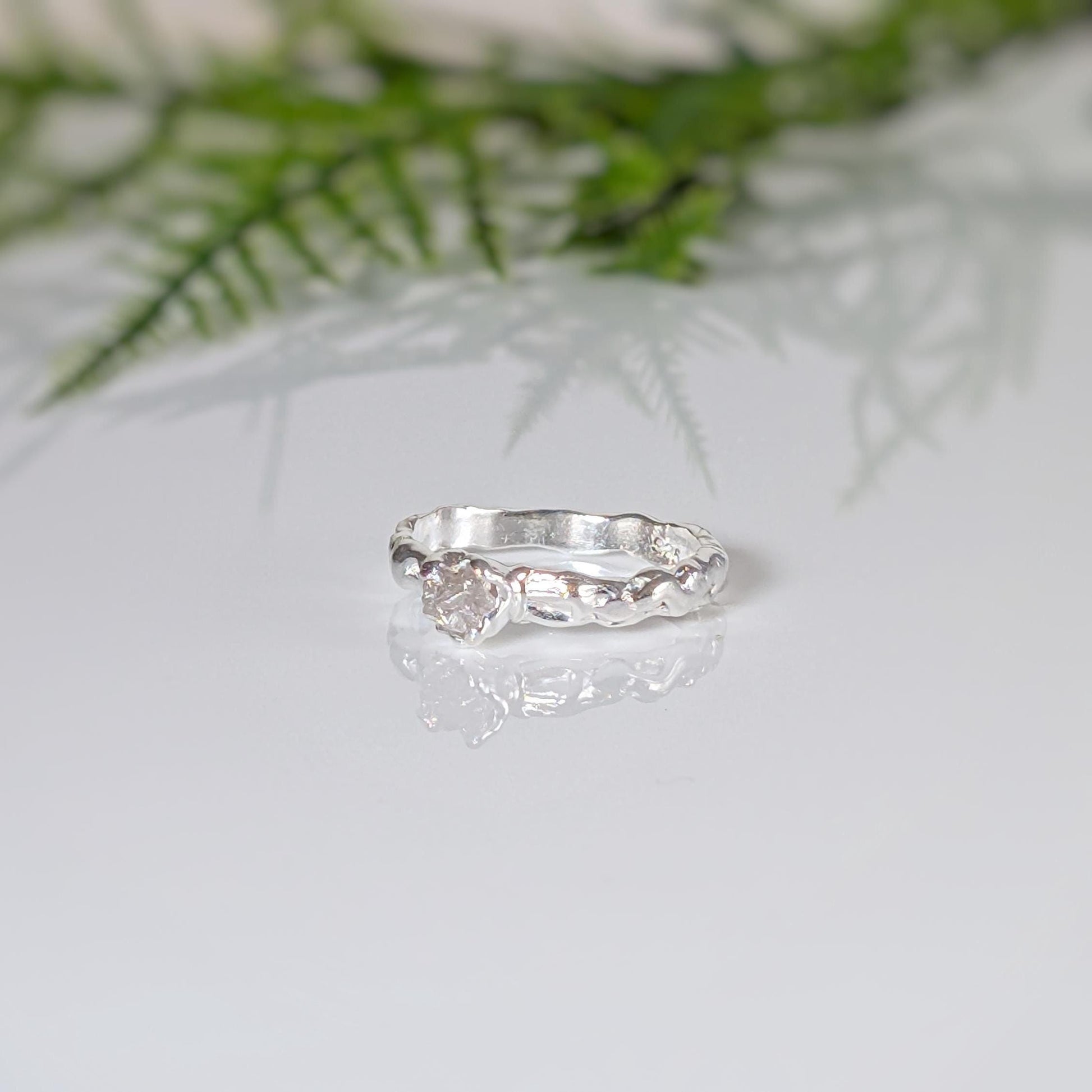 Rustic raw diamond engagement ring in recycled Sterling Silver with a unique Molten texture, reflecting earthy elegance.
