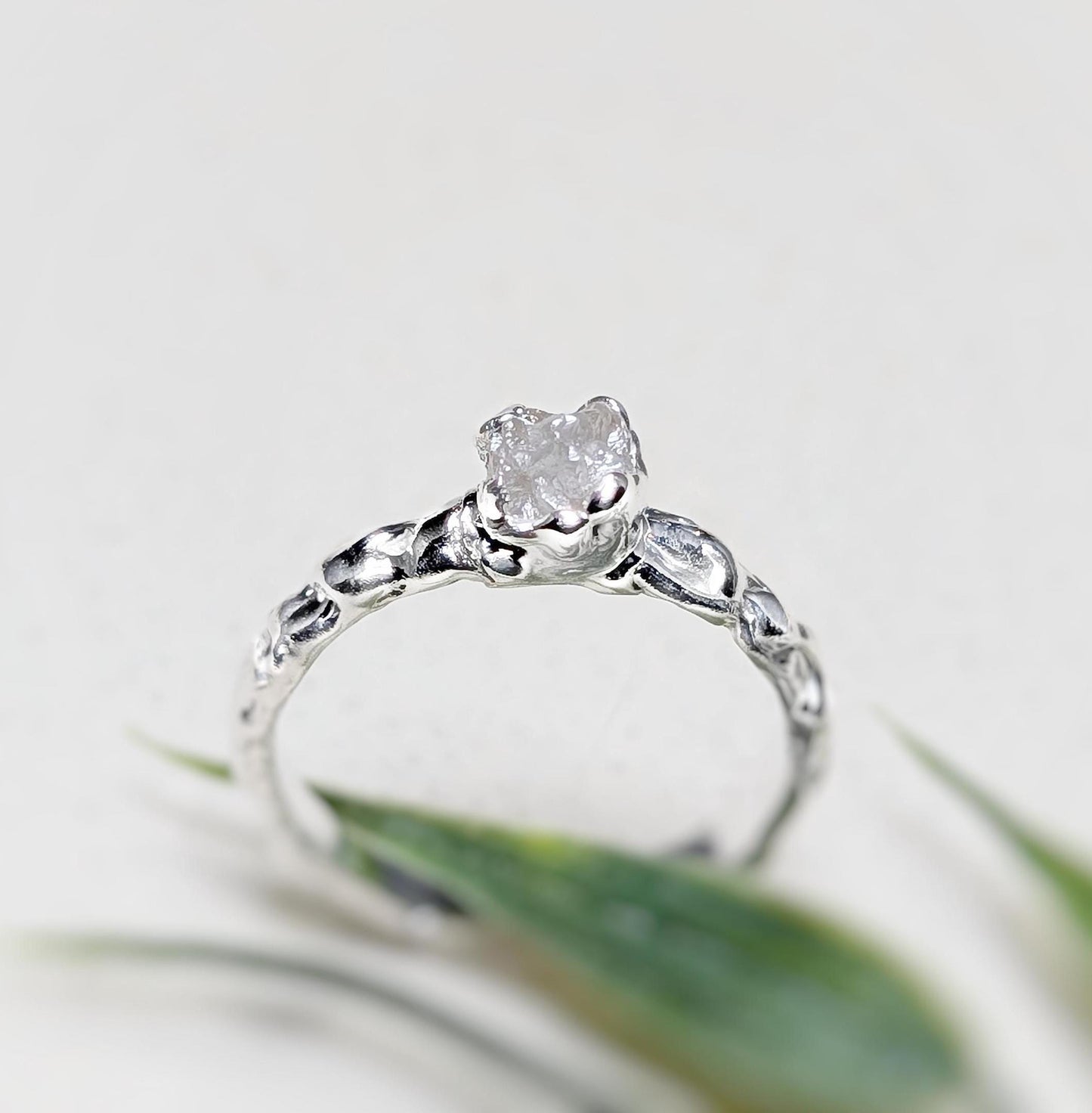 Handcrafted rustic rough diamond engagement ring in recycled sterling silver with unique Molten texture.
