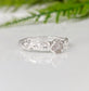 Rustic raw diamond engagement ring set in recycled sterling silver, featuring an organic, molten texture.