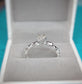 Raw diamond engagement ring in recycled sterling silver showcasing unique molten texture, set in elegant jewelry box.