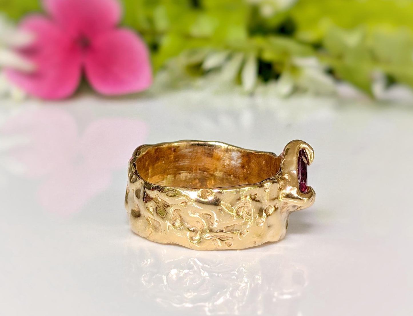 Rubellite Tourmaline solid gold textured ring showcasing a unique design, perfect for elegant jewelry lovers.