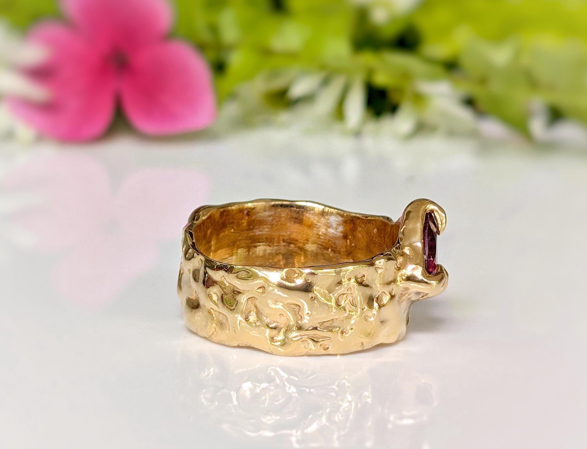 Rubellite Tourmaline solid gold textured ring showcasing a unique design, perfect for elegant jewelry lovers.