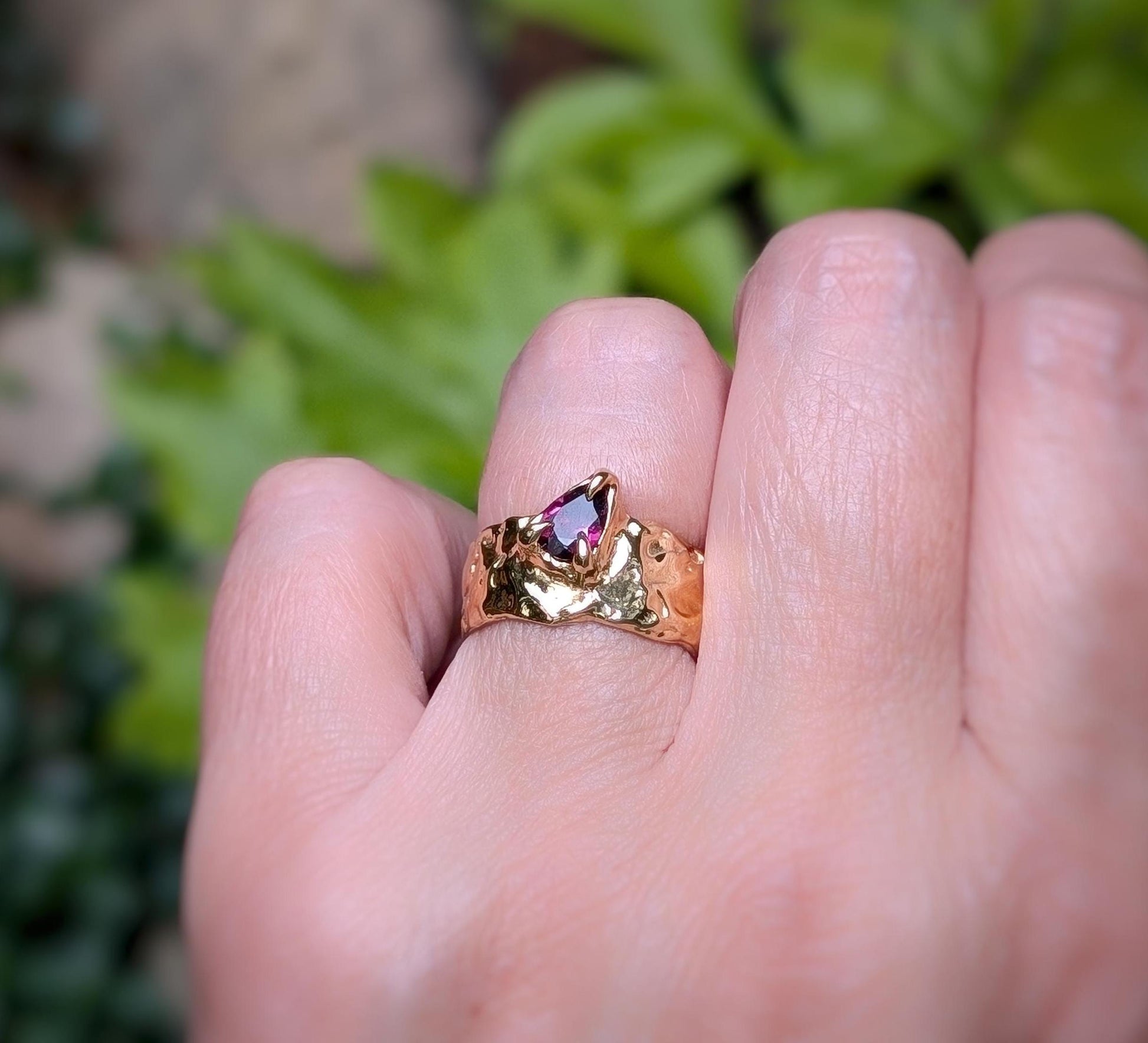 Handcrafted solid gold textured ring featuring a natural pear-shaped Rubellite Tourmaline gemstone.