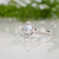 Textured sterling silver ring featuring a creamy-white Freshwater Keshi pearl, perfect for elegant simplicity.