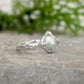 Silver textured ring featuring a creamy-white Freshwater Keshi pearl in a unique organic design.