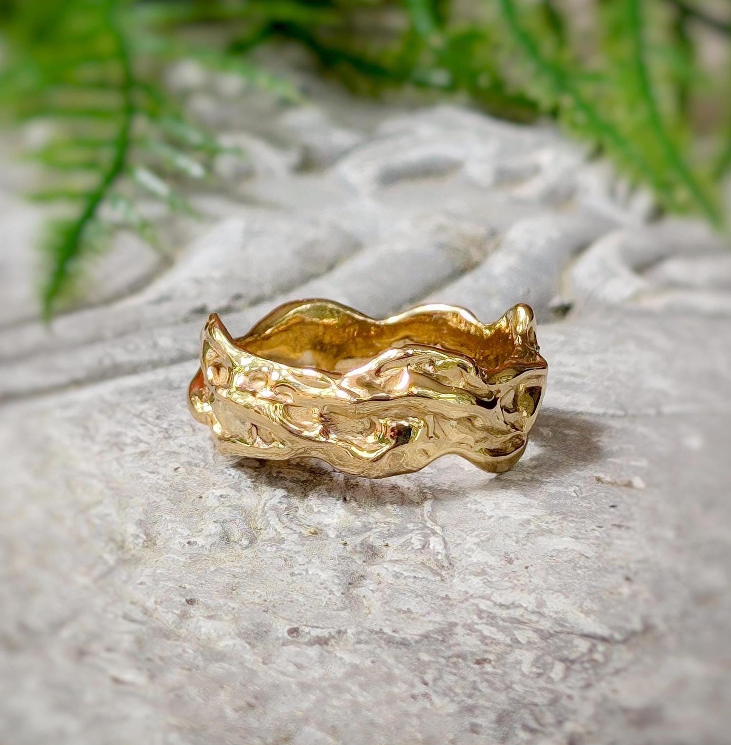 Handcrafted solid 14k gold molten textured wedding band with irregular abstract form, perfect for men or women.