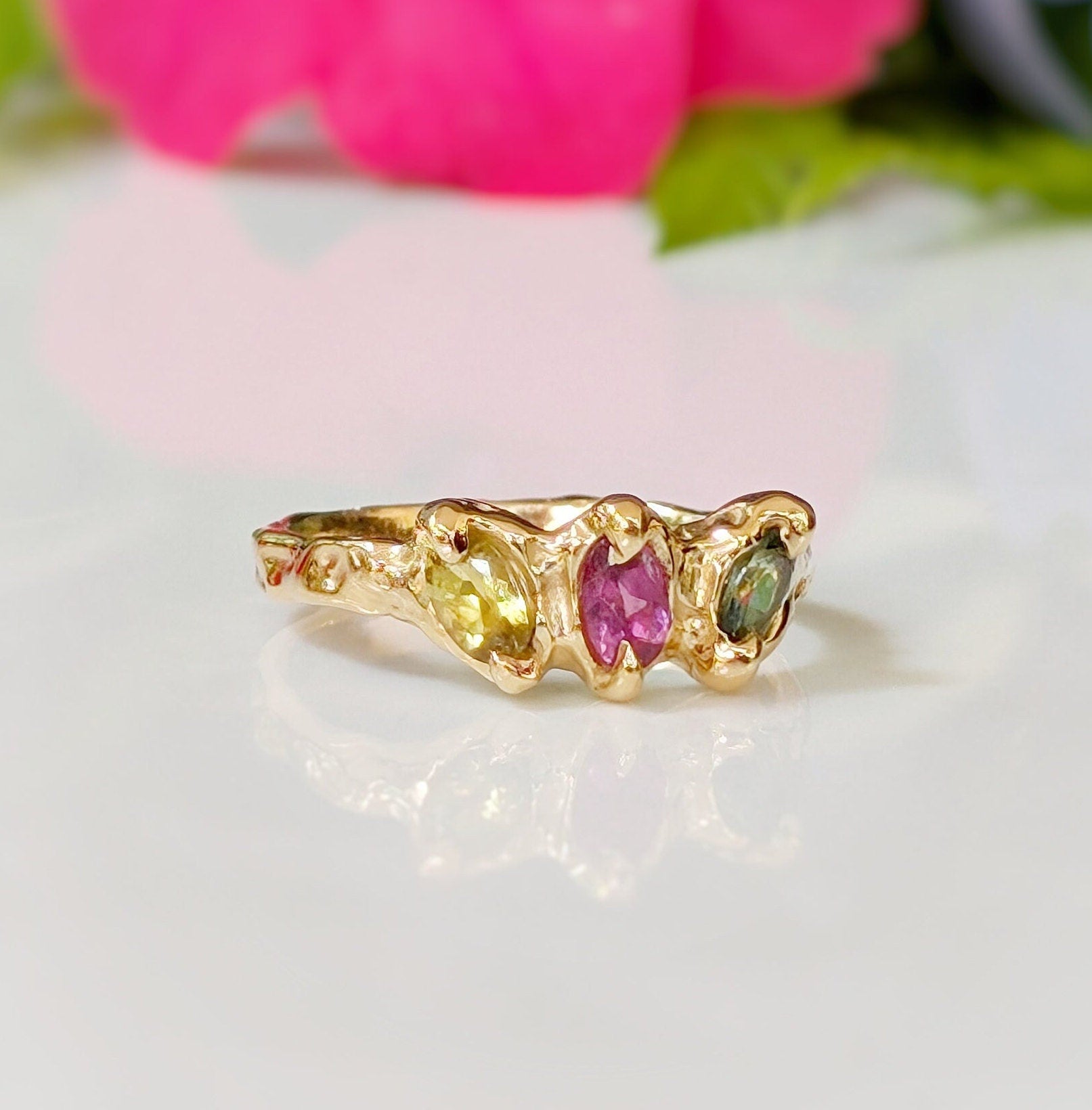 Solid gold multi Tourmaline ring featuring three colorful gemstones set in organic design, perfect as a promise or engagement ring.