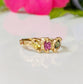 Solid gold multi Tourmaline ring featuring three colorful gemstones set in organic design, perfect as a promise or engagement ring.