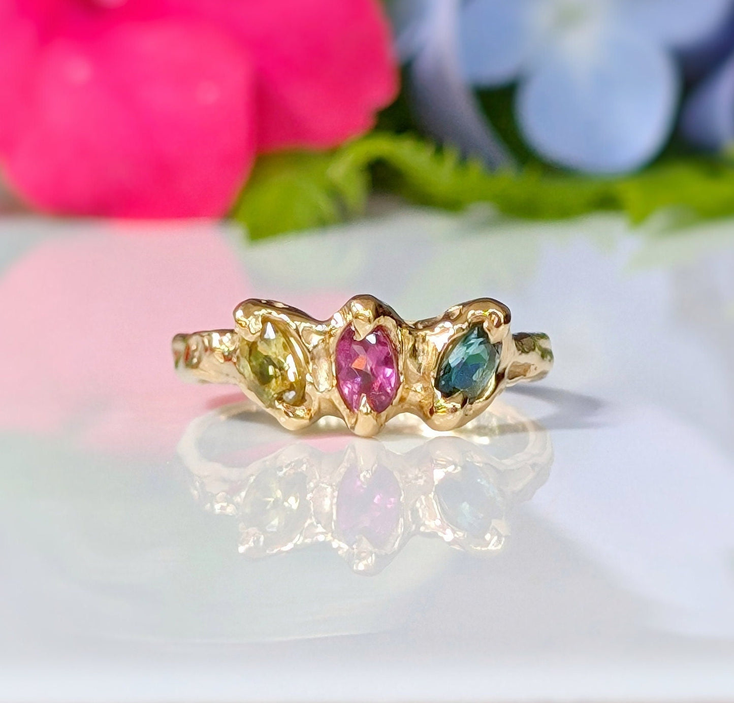 Solid gold multi Tourmaline ring featuring three colorful gemstones, perfect as a unique promise or engagement ring.