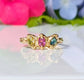Solid gold multi Tourmaline ring featuring three colorful gemstones, perfect as a unique promise or engagement ring.