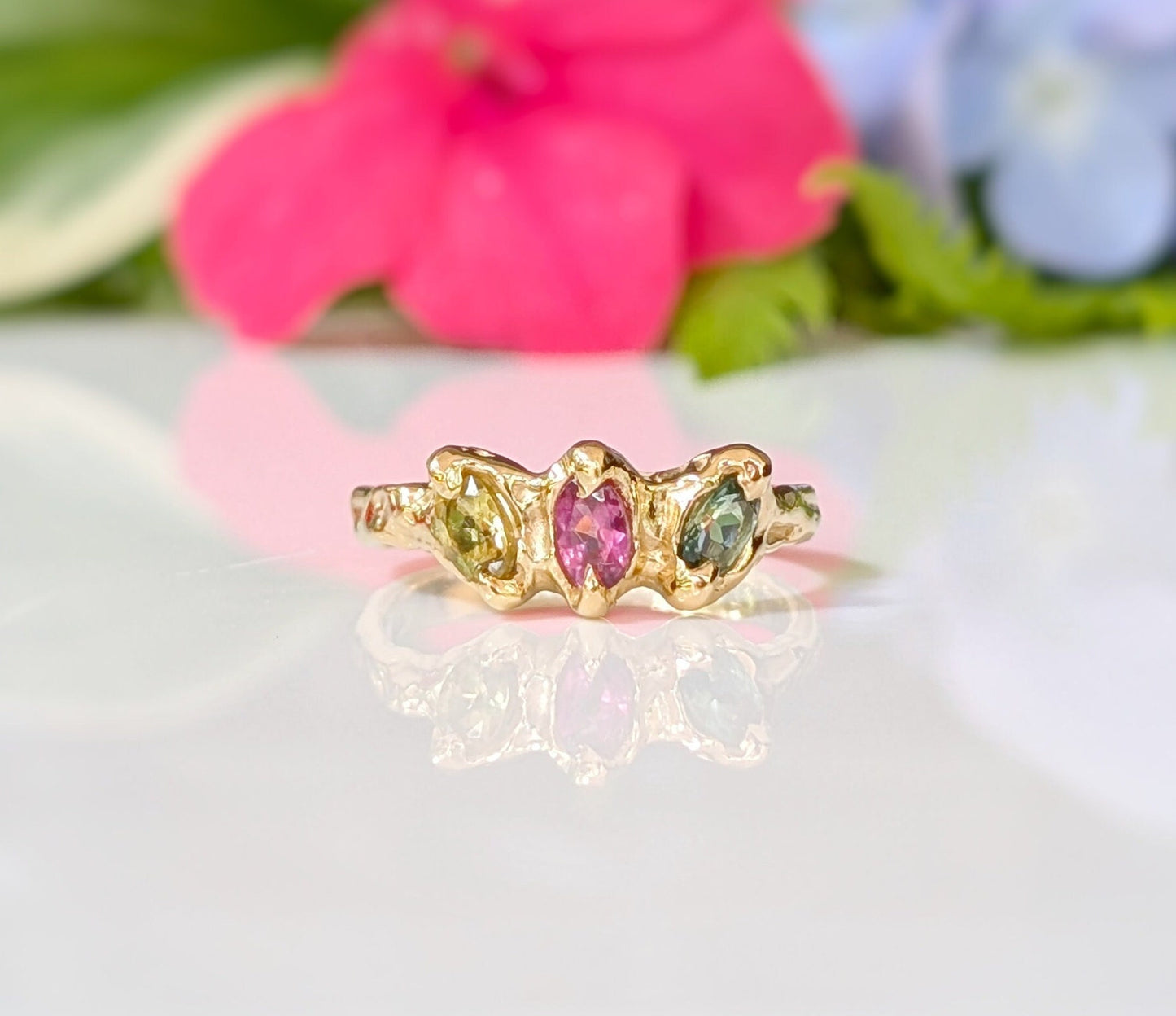 Solid Gold multi Tourmaline ring with three colorful gemstones in a unique design, perfect as a promise or engagement ring.