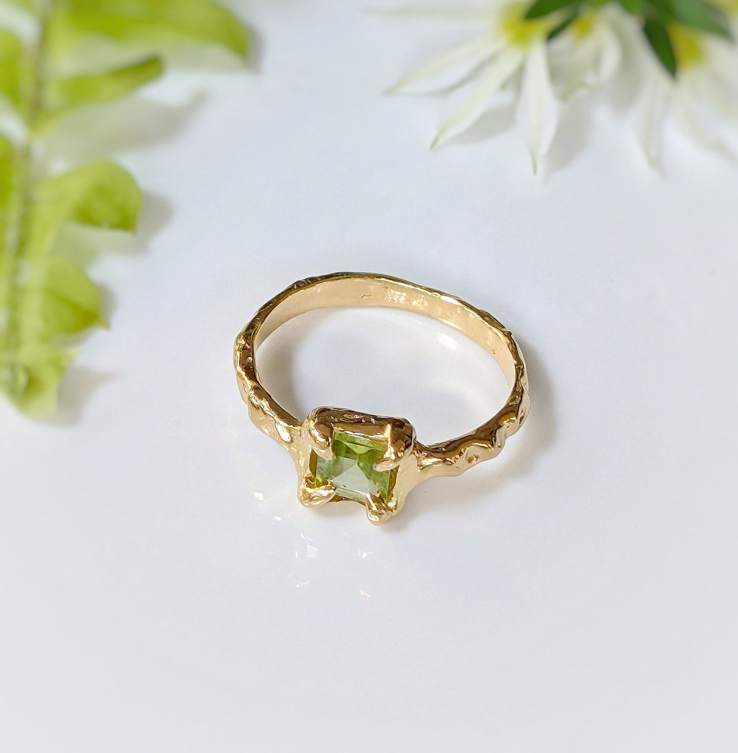 Solid gold Peridot ring featuring organic textured band, showcasing a princess-cut Peridot, ideal for engagement or special occasions.