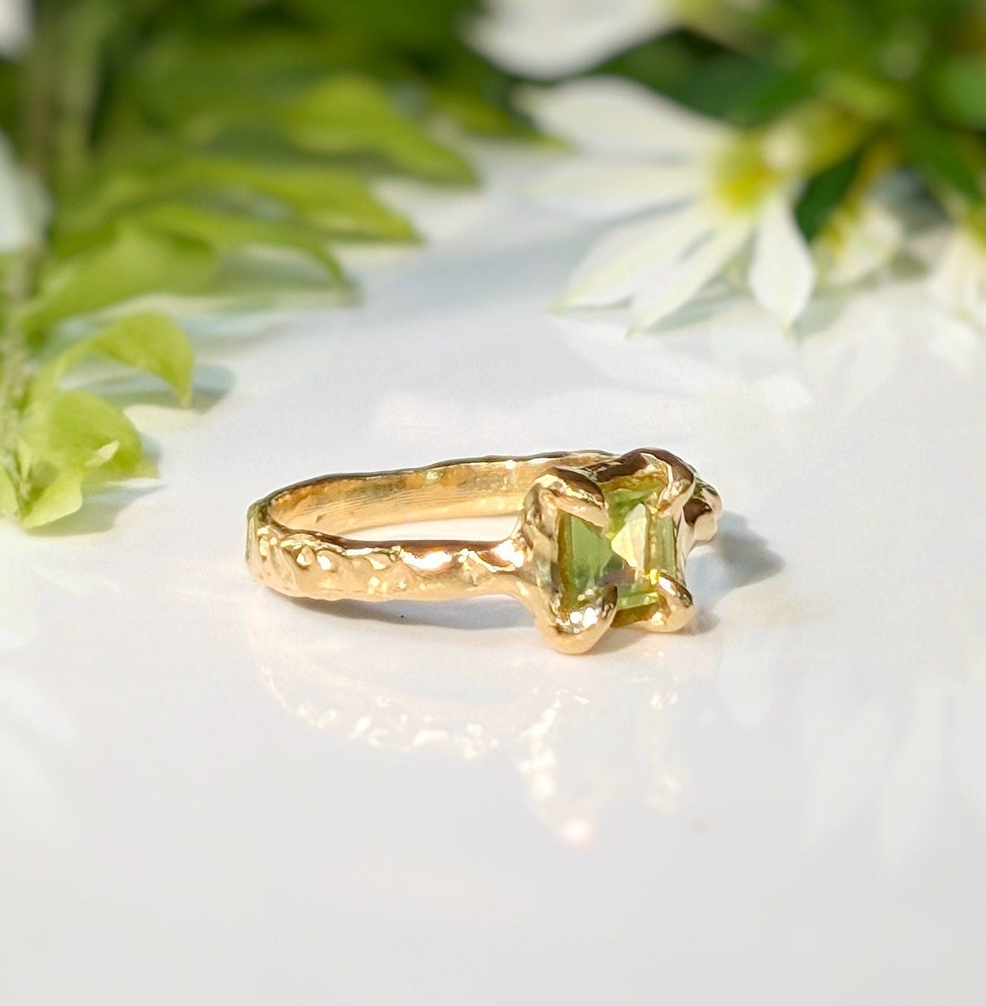 Handcrafted Solid 14k Gold Peridot ring with unique organic textured band and princess-cut green crystal.