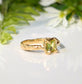 Handcrafted Solid 14k Gold Peridot ring with unique organic textured band and princess-cut green crystal.
