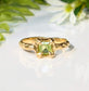 Elegant solid gold Peridot ring with organic textured band and princess-cut stone, perfect for symbolizing timeless love.