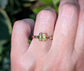 Solid 14k gold ring featuring a princess-cut Peridot, showcasing a unique organic textured band.