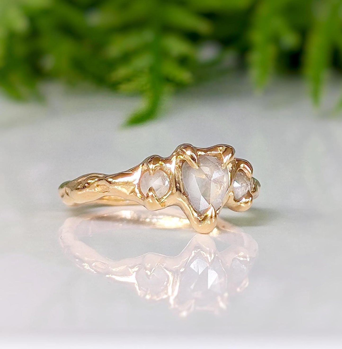 Rustic textured gold engagement ring featuring unique Salt & Pepper diamonds in a romantic design.