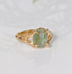 Solid 14k Gold textured ring featuring an oval-shaped green Kyanite gemstone on a unique organic band.