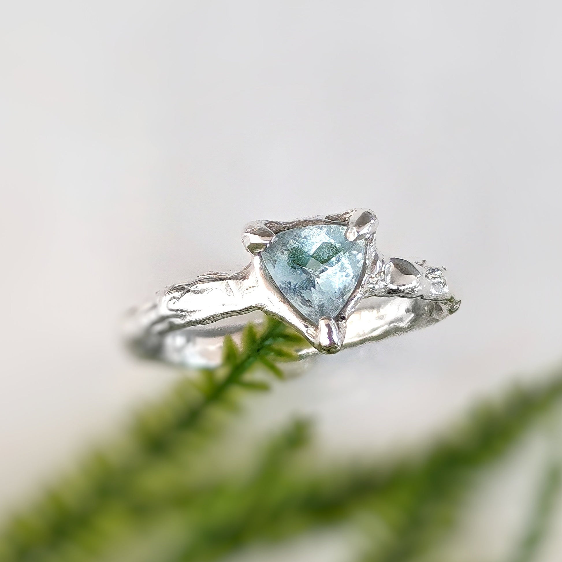 Solid silver handcrafted ring featuring a trilliant shape aquamarine gemstone, symbolizing timeless love.
