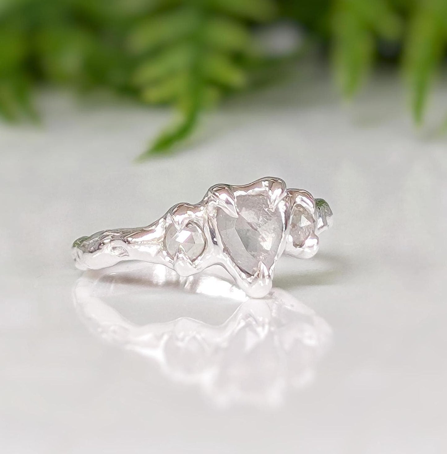 Rustic sterling silver engagement ring featuring three unique Salt & Pepper diamonds, perfect for a one-of-a-kind proposal.