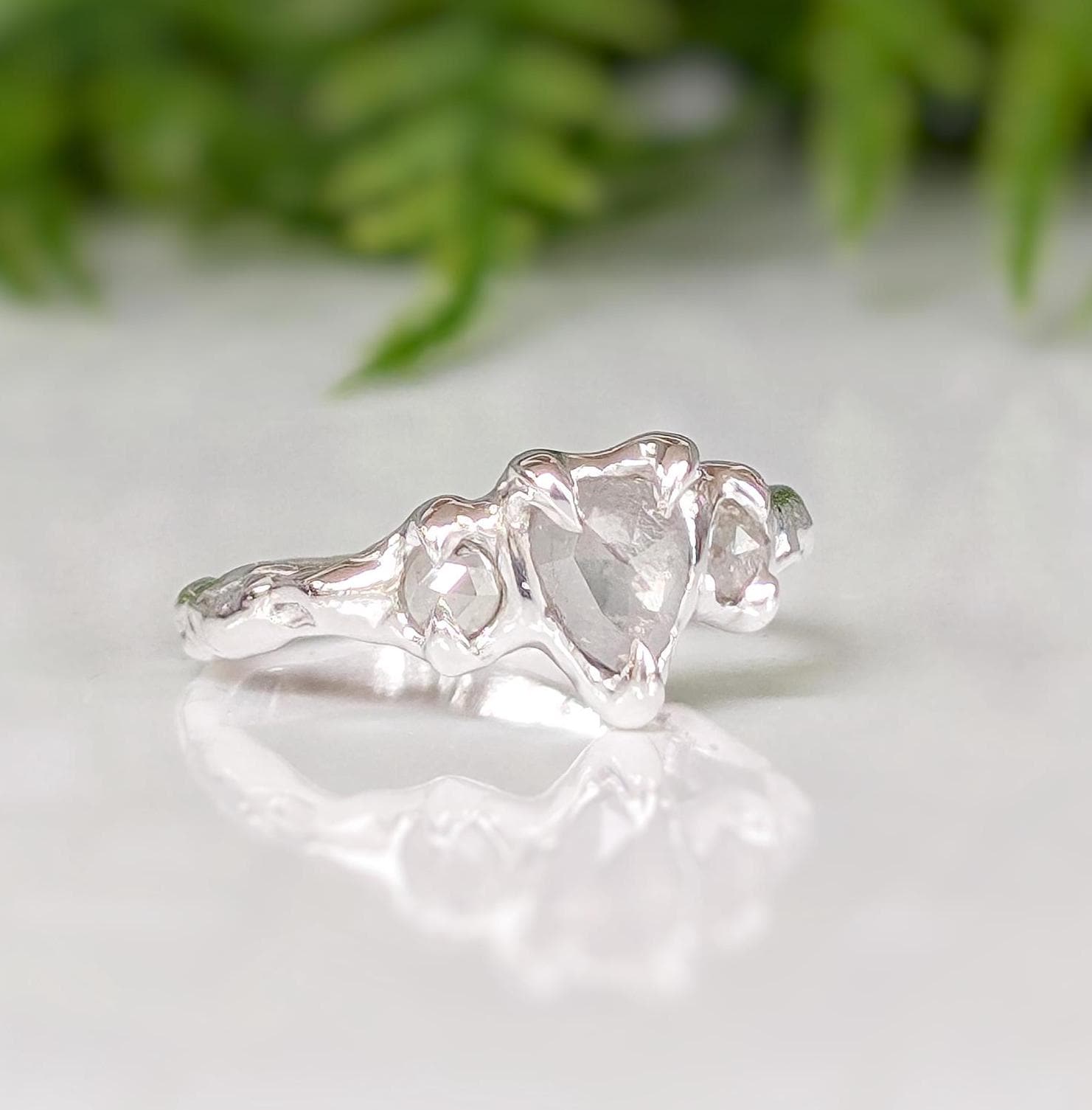 Rustic sterling silver engagement ring featuring three unique Salt & Pepper diamonds, perfect for a one-of-a-kind proposal.