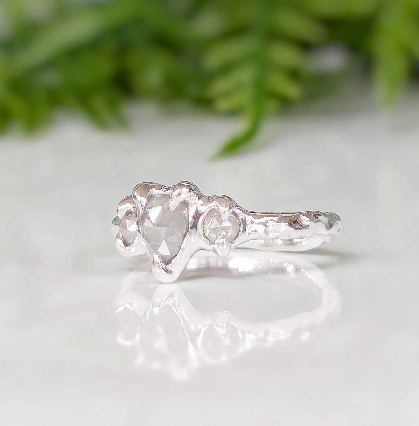 Rustic sterling silver engagement ring featuring salt & pepper diamonds, perfect for a unique proposal.