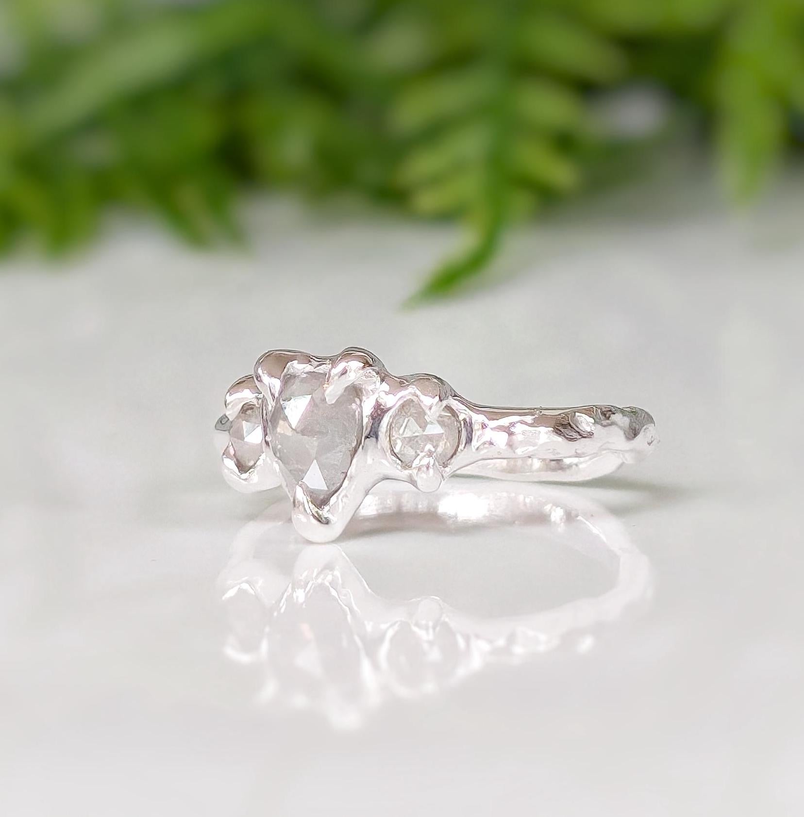 Rustic sterling silver engagement ring featuring salt & pepper diamonds, perfect for a unique proposal.