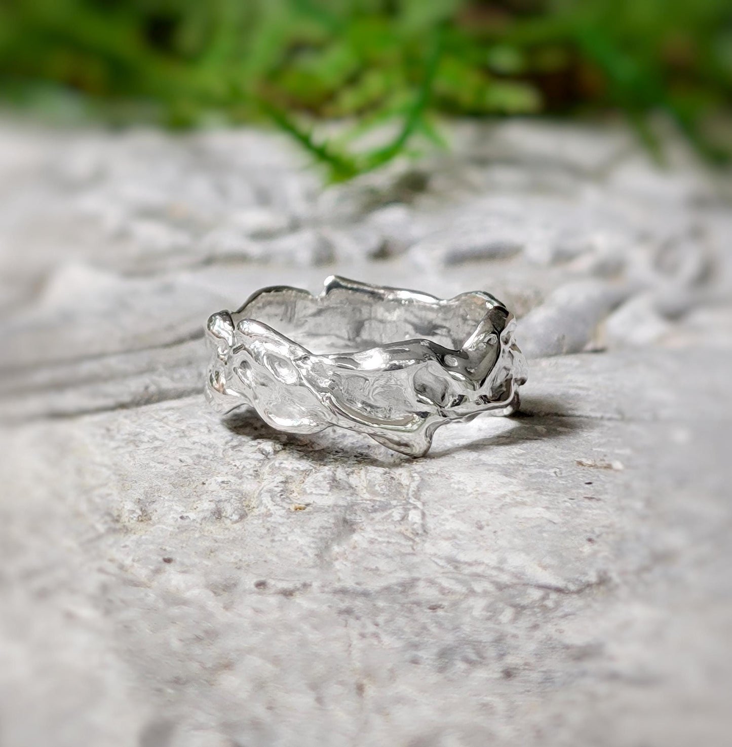 Handcrafted Sterling Silver Molten Textured ring with an abstract design, showcasing a unique and nature-inspired wedding band.