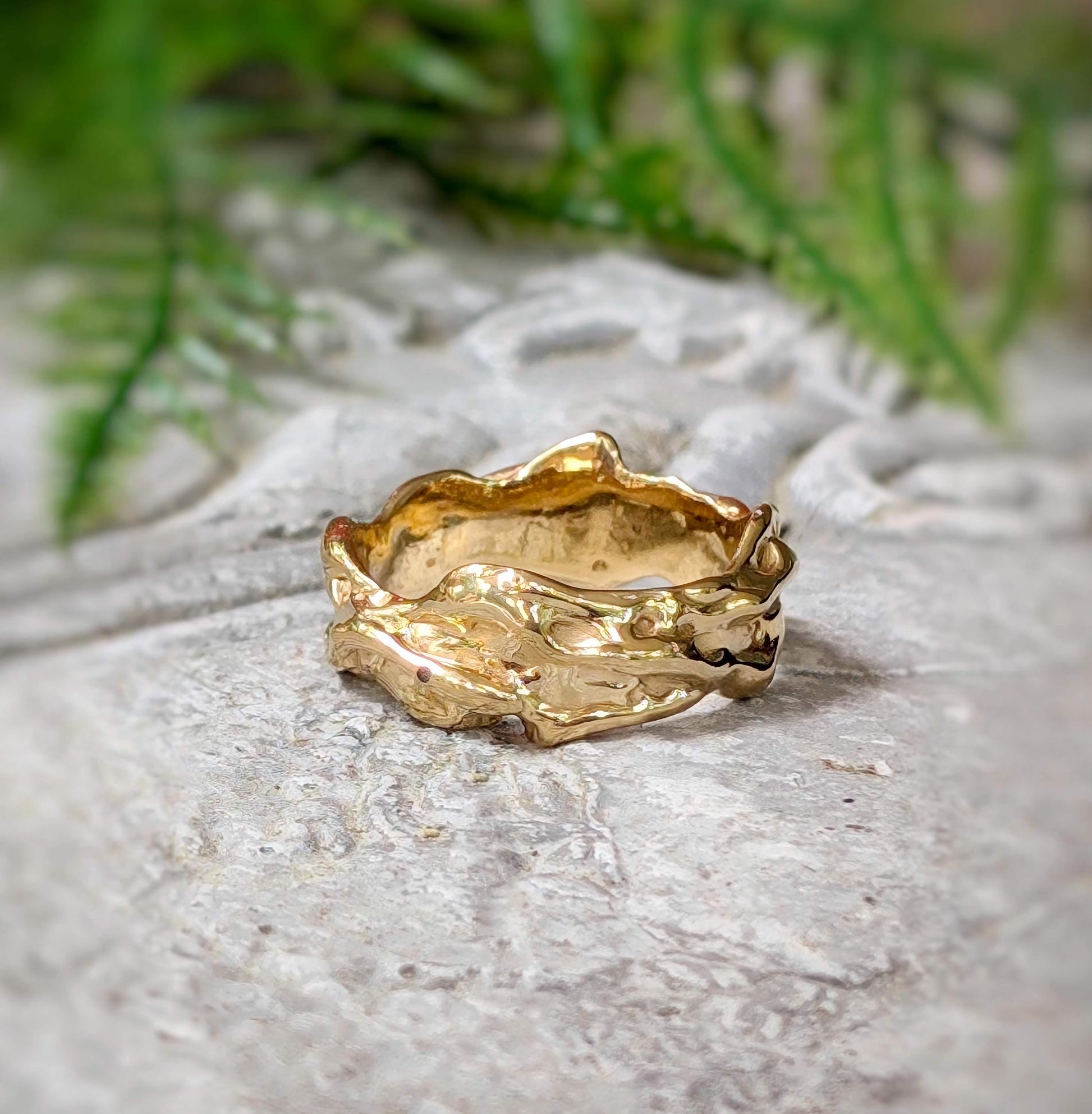 Textured molten gold wedding ring showcasing an irregular, fluid design, handcrafted in Solid 14k Gold.