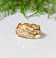 Textured Molten Gold wedding ring featuring a unique, handcrafted design in Solid 14k Gold.