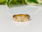 Handcrafted Molten Gold Wedding Ring with rustic textures, showcasing a wide band design inspired by nature's beauty.