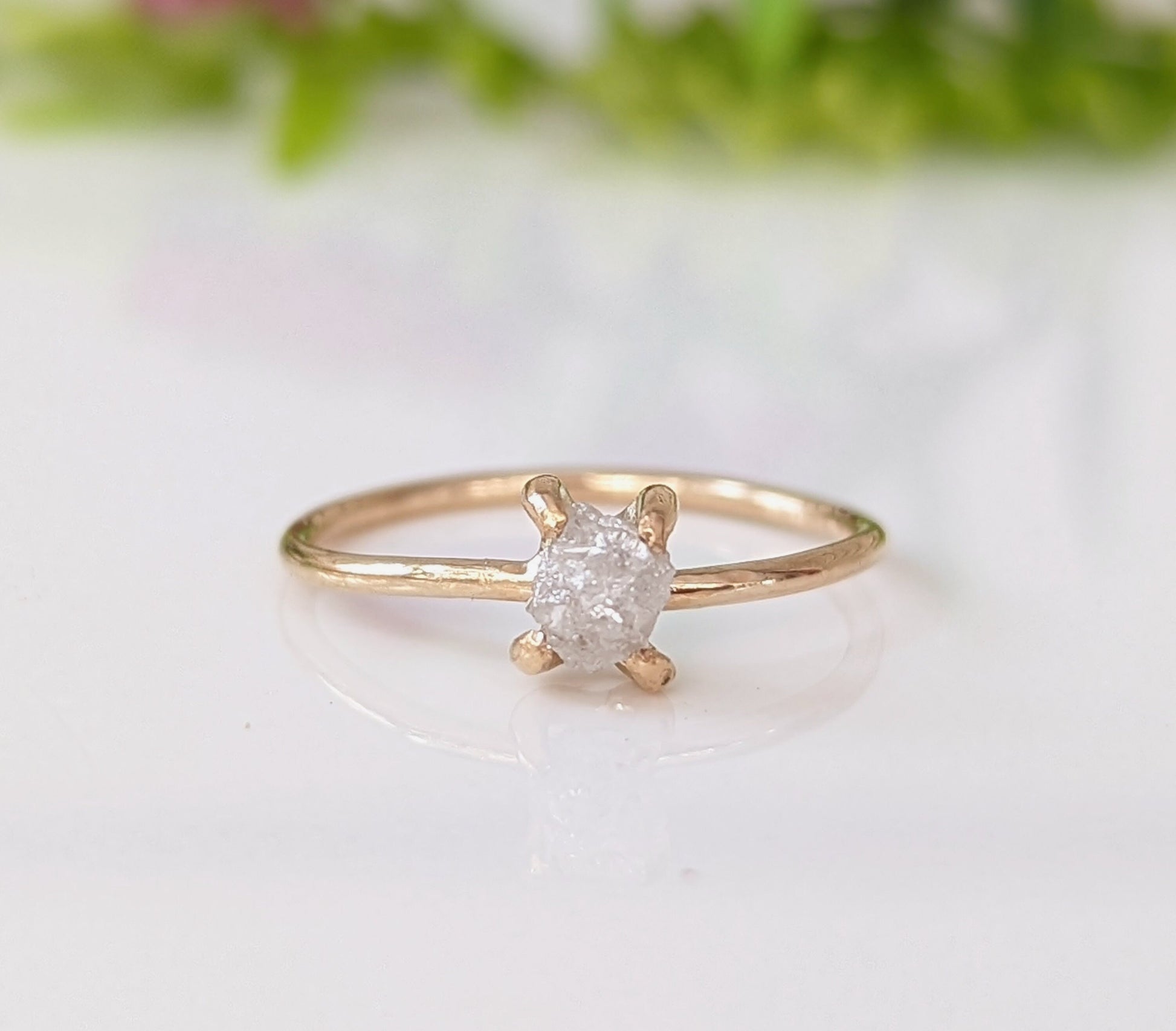 Sterling silver raw diamond engagement ring with prong setting, featuring unique crystal shine.