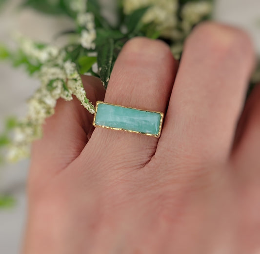 Amazonite gold bar ring on finger, featuring a 6x18mm natural stone on a 14k gold-filled band.