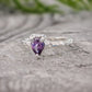 Amethyst engagement ring in solid sterling silver with a pear-shaped purple gemstone.