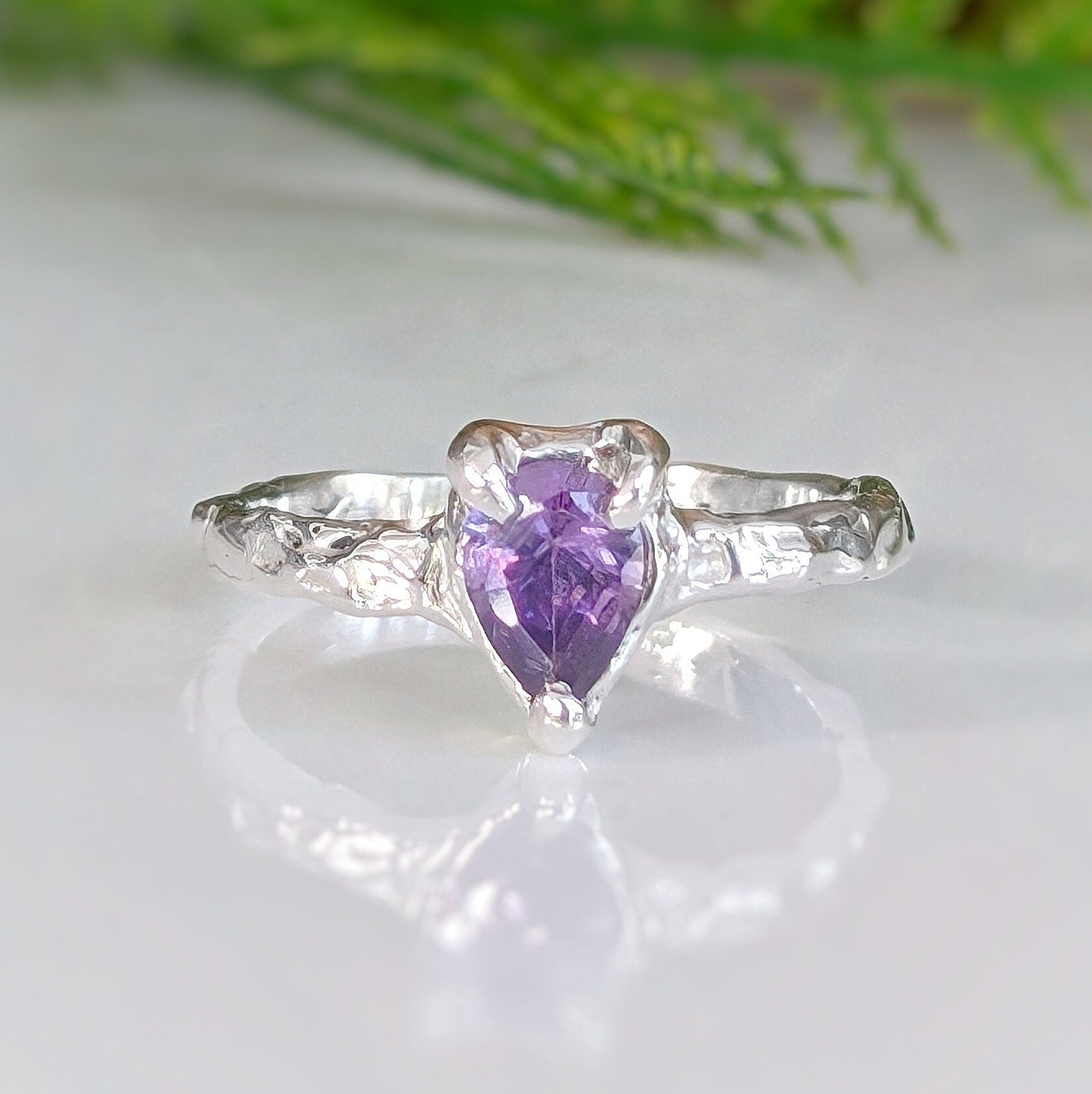 Handcrafted amethyst engagement ring in solid sterling silver with organic textured band.